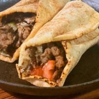 Beef Shawarma · Gluten-free. Thin Slices of Marinated Tri-Tip Beef Served with Lettuce, Tomatoes, Onions, an...
