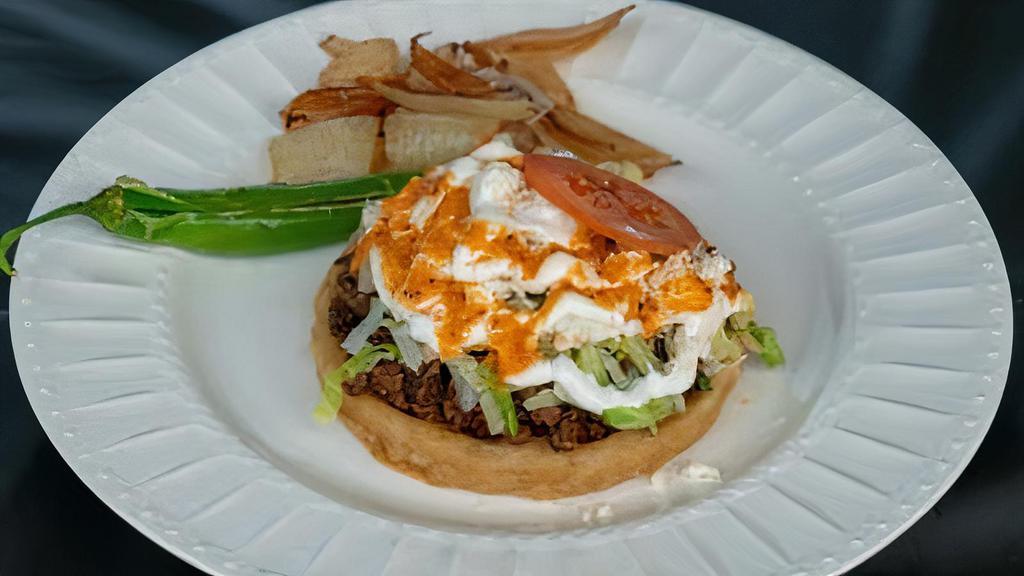 Sopes · Beans, lettuce, cheese, sour cream, tomatoes, salsa and your choice of meat.