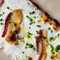 Truffle Bacon Flatbread · Mozzarella, burrata, provolone, parmesan, bacon, chives, and truffle oil, finished with herb...