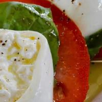 Caprese Salad · Roma tomato, burrata, basil, extra virgin olive oil