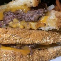 Patty Melt · Half pound beef patty, rye bread, cheddar cheese, grilled onions, side of fries.