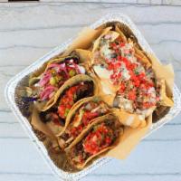Taco Box · Choice of 4 tacos with a side of carnitas nachos