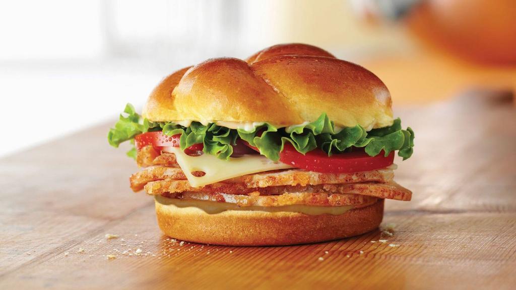 Turkey Classic · Choice of smoked or roasted honey baked turkey breast topped with swiss cheese, lettuce, tomato, Duke's® mayonnaise, and hickory honey mustard on a baker's roll. 560-590 cal.