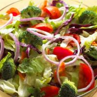 Garden Side Salad · Crisp Lettuce, Red Cabbage, Cucumbers, Carrots, Tomatoes, Served with Your Dressing of Choice