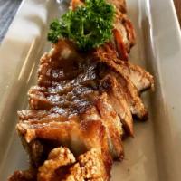 Singha Beer Crispy Pork · Marinated pork belly and served with chili lime sauce and sweet black thick sauce.
