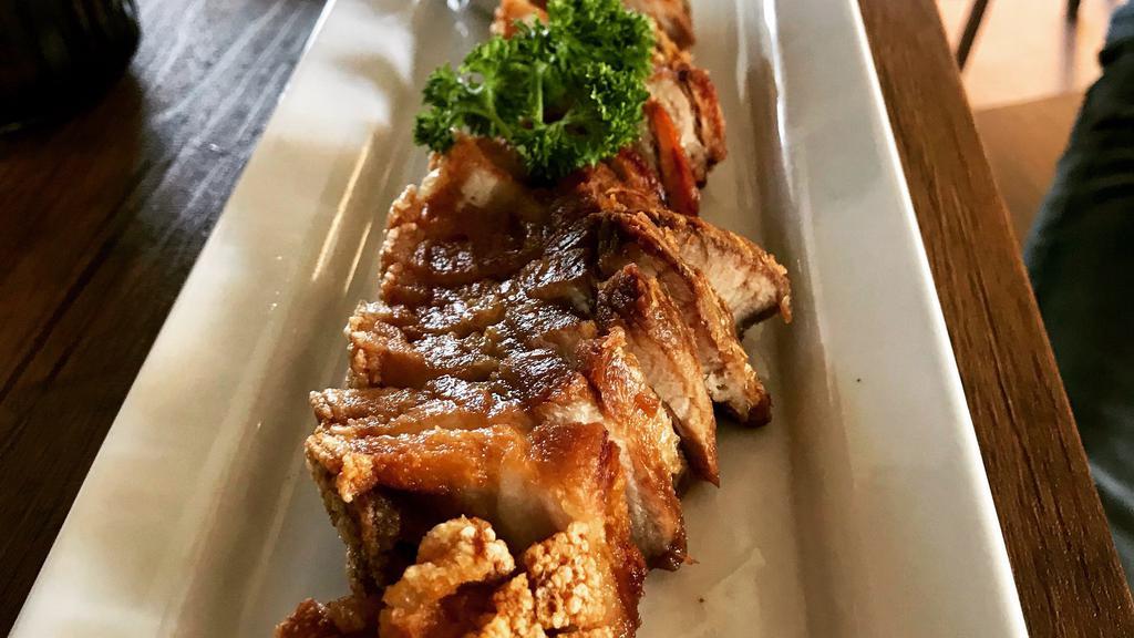 Singha Beer Crispy Pork · Marinated pork belly and served with chili lime sauce and sweet black thick sauce.