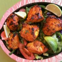 Chicken Tikka · Boneless chicken breast marinated in yogurt, mils spices, herbs and roasted in a tandoori oven