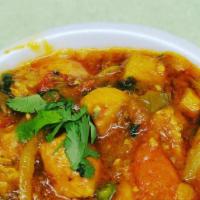Chicken Bhuna · Chicken cooked with tomatoes and bell pepper curry sauce
