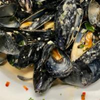 Black Mussels  “Poulette ’’ Appetizer · With white wine, shallots sauc