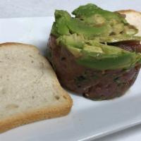 Tuna Tartare · Served with avocado, fresh basil, black sesame seed and ginger soy sauce.