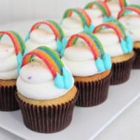 Rainbow Confetti · Vanilla bean cake with rainbow sprinkles. Iced with buttercream topped with rainbow candy st...