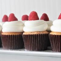Vanilla Bean Raspberry  · Vanilla bean cake, filled with gourmet seedless raspberry and iced in buttercream and a fres...