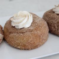 Cronuts · Baked not fried cronuts! Dipped in butter and covered in cinnamon sugar and a dollop of whip...