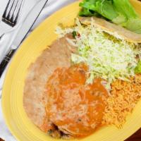 Chile Relleno & Taco · Served with refried beans and mexican style rice.