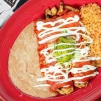 Enchiladas Suizas · Two chicken enchiladas topped with tomatillo sauce and cheese. Garnished with guacamole and ...