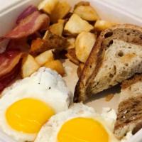 All American Breakfast · 2 Eggs any Style, Bacon or Sausage, Toasted Bread and Breakfast Potatoes
