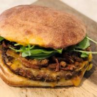Black Bean Veggie Burger · Fan Favorite!! Shallot Strings, Cheddar Cheese, Arugula and Vegan Mayo