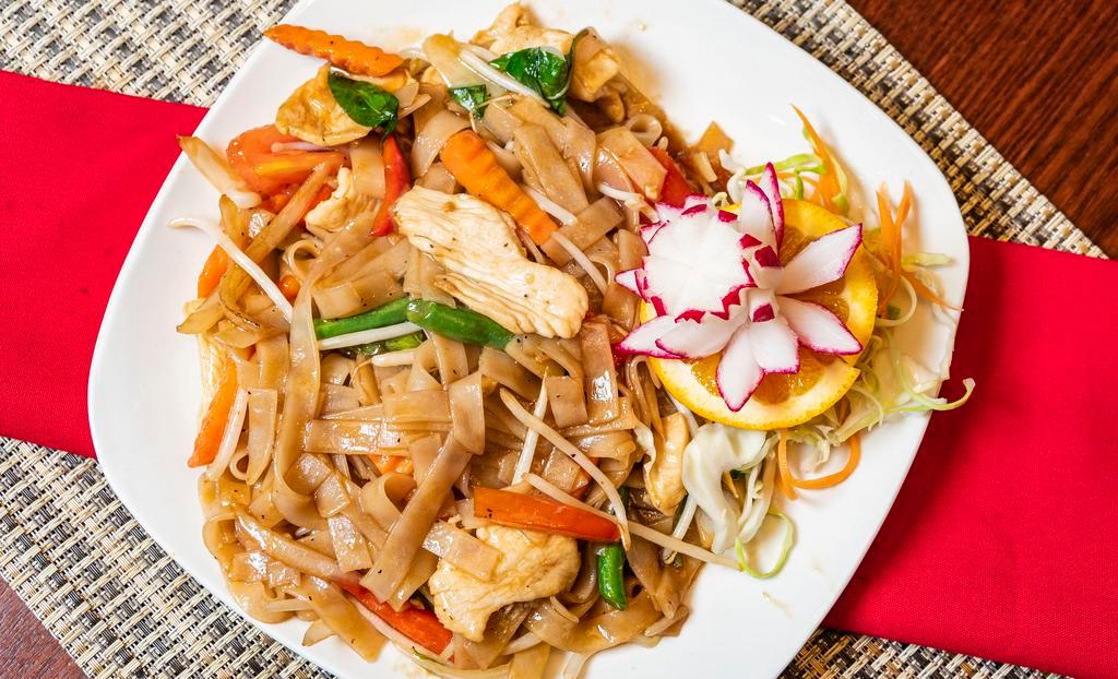 Drunken Noodles (Spicy Noodles, Pad Kee Mow) · Pan-fried rice noodles with green beans, onions, bell peppers, tomatoes, carrots, bean sprouts, basil, and garlic chili sauce.