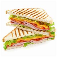 Club House Sandwich · Tomato, lettuce, bacon, avocado, and your choice of deli turkey, ham, or turkey breast.