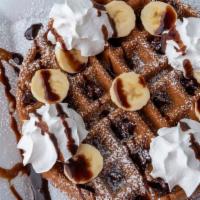 Chocolate & Banana Waffle · Topped fresh bananas, chocolate chips, powdered sugar and whip cream.