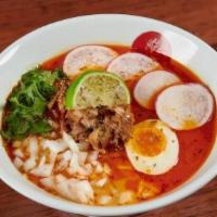 Carnitas Ramen · Spicy tonkotsu chicken and pork broth, egg noodles, housemade carnitas, ½ ramen egg, radish,...