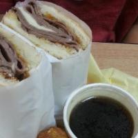 French Dip With Au Jus · Hot roast beef with melted Provolone cheese. Just meat and cheese.