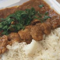 Chicken Curry & Rice Or Naan · Spicy. Tender chicken pieces in a blend of spices and curry sauce.