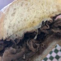 Taylor'S Famous French Dip · Sliced roast beef cooked in our homemade au jus sauce, with provolone cheese on a hoagie rol...