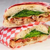 Sean'S Blt · Loaded with bacon and tomato, sitting on top a bed of spinach with provolone cheese, topped ...