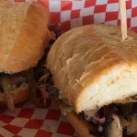 Shannon'S Pulled Beef Philly Style · Sliced roast beef with sauteed wild mushrooms, sweet onion and blue cheese, toasted and serv...