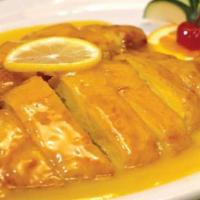 Lemon Chicken · Crispy battered chicken breast pieces smothered in a sweet and tangy lemon sauce