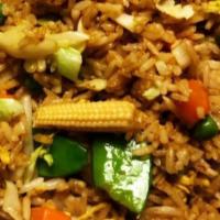 Vegetarian Fried Rice · Veggie fried rice with corn peas, creamy eggs, fresh herbs, garlic, and ginger