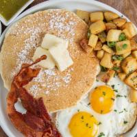 American Breakfast · 2 eggs, 2 mini pancakes, bacon, choice of breakfast potatoes or fruit.