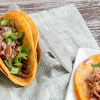 4 Tacos De Birria · 4 birria tacos with a side of birria broth.