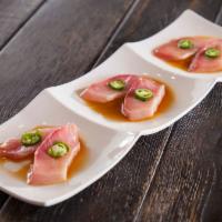 Yellowtail Jalapeno · Thinly sliced fresh yellowtail topped with jalapeno and cilantro. Served with citron ponzu s...