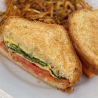 Brioche Breakfast Grilled Cheese Sandwich · Organic Baby Spinach, White Cheddar Omelet, Your choice of Honey Cured Bacon, Pork Sausage, ...