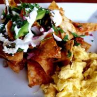 Chilaquiles · 2 Eggs, Corn Tortilla Chips, Tossed in your choice of Red or Green Sauce, and choice of Chor...