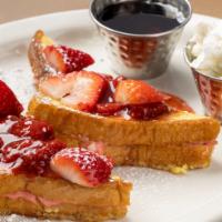 Strawberry-Stuffed French Toast · Strawberry cream cheese, dusted with Cinnamon sugar. Served with whipped butter, and maple s...