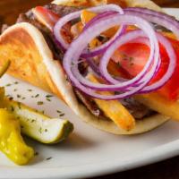 Greek Gyro · A little taste of Greece. Lightly grilled Pita bread, filled with Gyros Meat, Tzatziki Sauce...