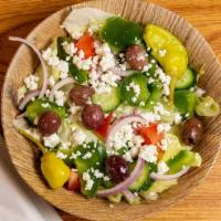 Greek Salad · Fresh Iceberg Lettuce, Cucumber, Tomato, Onion, Bell Pepper, Pepperoncini, Feta Cheese & Rip...