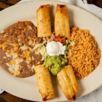 Flour Flautas · Beef or chicken wrapped in flour tortilla, deep fried, garnished with citrus relish, cream, ...