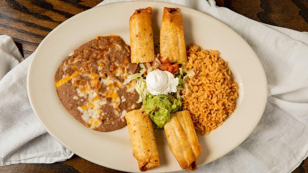 Flour Flautas · Beef or chicken wrapped in flour tortilla, deep fried, garnished with citrus relish, cream, guacamole and cotija.
