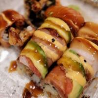 Rainbow Roll · Crabmeat and avocado inside topped with assorted fish masago and avocado.