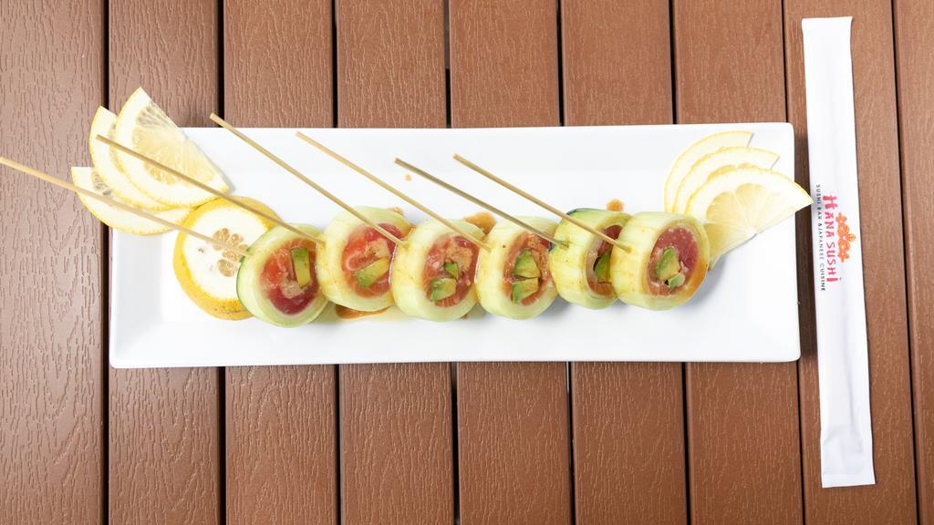 Magic Roll · Tuna, salmon, red snapper, crabmeat and avocado inside wrapped with cucumber and yuza sauce.