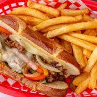 Philly Cheesesteak Sandwich · Chopped ribeye steak, red and green bell peppers, onions, and provolone cheese on soft pretz...