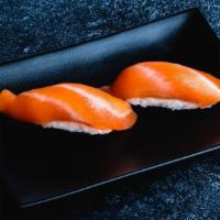 Salmon Sushi · Each order comes in 2 pieces. Serves with Wasabi and Ginger.