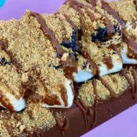 The S'Mores Pop · chocolate milkshake pop + milk chocolate dip + toasted marshmallows with crushed graham crac...