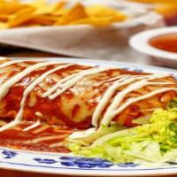 Burrito Mojado / Wet Burrito · Traditional and delicious wet burrito, covered in red chile sauce, severed with Spanish rice...