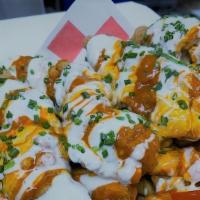 Loaded Buffalo Fries · Waffle Fries loaded with Cheddar Cheese, Chicken Tenders, Buffalo Sauce, Ranch Dressing, Top...
