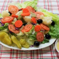 Dinner Salad · Crunchy iceberg and romaine lettuce, red cabbage, fresh tomatoes, black olives, giardiniera ...